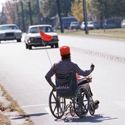Handicapped Mike Middleton acts as lunchtime crossing guard