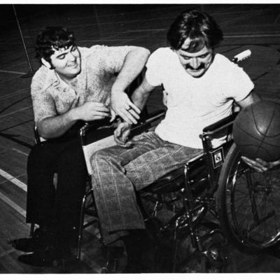Jim Hayes and unidentified player during UTA wheelchair basketball play