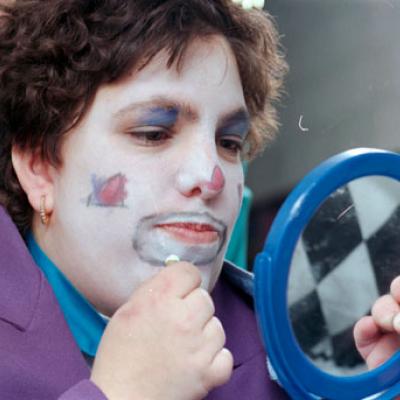 clown putting on makeup