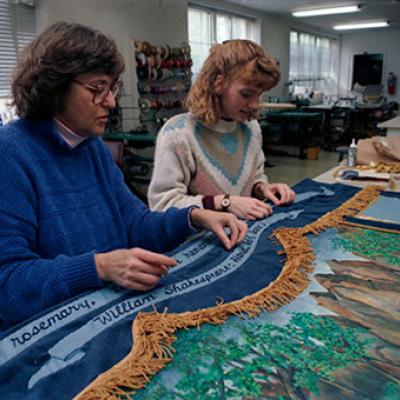 Lori Van Zandt (left) and Gretchen Pahan (right) work on quilt