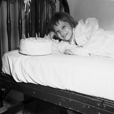 Marguerite Clarke, polio patient, with her birthday cake