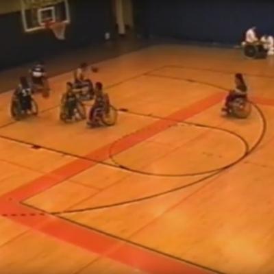 wheelchair basketball players warming up on court